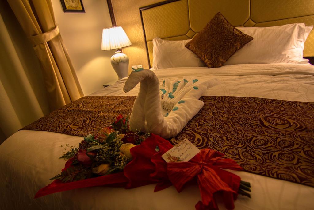 Rest Night Serviced Apartments- Alhamra Ριάντ Δωμάτιο φωτογραφία A towel swan